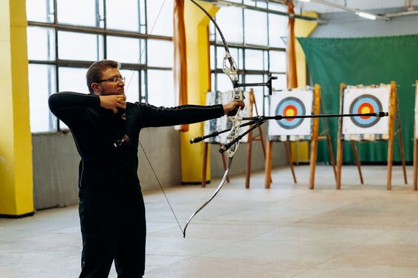 Man focusing on his form during a bodyweight exercise in a calm space.